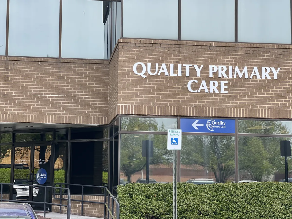 Front entrance and exterior signage of Quality Primary Care Associates at 818 West Diamond Avenue, Gaithersburg, MD