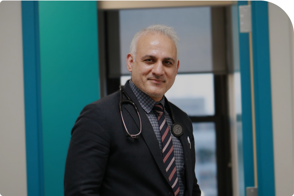 Doctor with stethoscope in office setting.