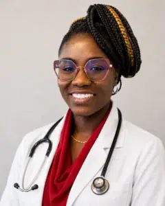 Smiling doctor wearing glasses and stethoscope